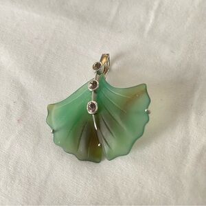 14 k gold setting with agate ginkgo leaf pendant  with brown sapphire accents.